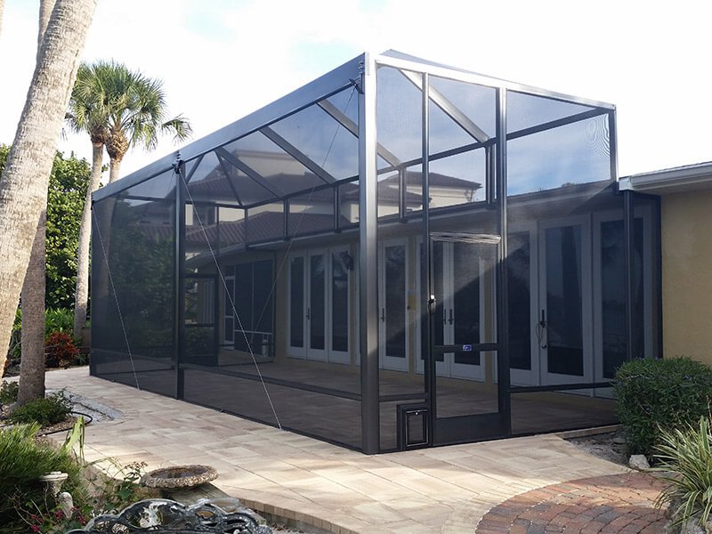 Screen enclosure extension installation in Fort Pierce, FL expanding residential patio space
